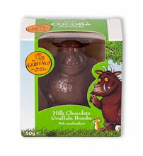 Load image into Gallery viewer, Image shows the Gruffalo Milk Hot Chocolate Bombe in its packaging with an illustration from The Gruffalo. Milk chocolate bombe is in the shape of the Gruffalo.