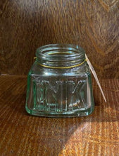 Load image into Gallery viewer, Image shows a glass pen storage pot that resembles an old empty jar of ink with the word ink stamped into the glass on one side.