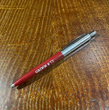 Load image into Gallery viewer, A red and chrome coloured retractable biro pen with the words 'Grimm & Co.' in white text against the red shaft.