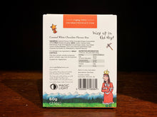 Load image into Gallery viewer, Image of the back of the Zog Gold Star Bar Packaging. The illustation of the sky, grass, and mountains continues from the front, this time with the Princess in the lower right corner, and a star in the top left corner. All the nutritional information is printed in the centre.