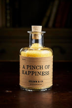 Load image into Gallery viewer, Image of A Pinch of Happiness otherwise known as scented yellow bath salts in a glass bottle with cork 