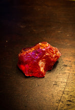 Load image into Gallery viewer, Image of a red Fire Rock, otherwise known as quartz stones plated in different metals to provide a rainbow sheen