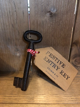 Load image into Gallery viewer, Image of Festive Entry Key - a metal decorative key tied with bakers twine and a kraft paper label