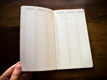 Load image into Gallery viewer, Image showing the inside of the calendar refill on pages showing days of the month.