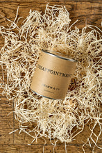 Load image into Gallery viewer, Image of a tin of Disappointment with a kraft label shown sat in a nest of wood wool.