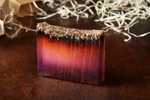 Load image into Gallery viewer, Image of 99% Phoenix Ash, otherwise known as lavender soap with lavender on top, shown without kraft label.