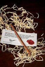 Load image into Gallery viewer, Image of a small handmade advanced wand, wooden decorative wand stamped with a black Grimm & Co 'G' monogram at the base of the handle. Wand has three dots of sterling silver at the tip, wand wood is a dark brown colour and comes with a wax sealed certificate of authenticity