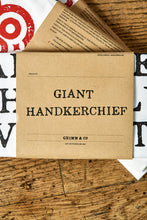 Load image into Gallery viewer, Image shows the kraft paper label of the Giant Handkerchief, otherwise known as a cotton tea towel.