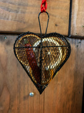 Load image into Gallery viewer, Image of the Scent of the Season Tree Decoration shaped as a heart. Decoration is a black wire shaped hanging box with hanging loop and ribbon. Box is filled with pot pourri including dried orange and green orange slices, a dried red chilli and cinnamon stick