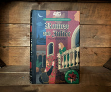 Load image into Gallery viewer, Image shows the book-shaped Jigsaw Library Romeo & Juliet with the front cover depicting Juliet on her balcony in Verona and Romeo reaching up to offer a rose.
