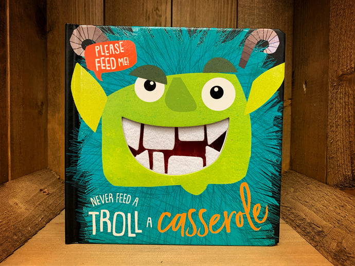 Image showing the front cover of the board book Never Feed A Troll A Casserole with a bold image of a green troll on the cover and white felt teeth inside a cut-out mouth on the cover.