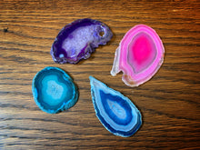 Load image into Gallery viewer, Image of four different coloured Crystallized Fairy Wings in pink, purple, blue and turquoise. all gems are made from slices of agate with patterned rings of colour in slightly different shapes.