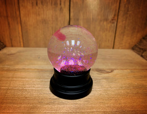 Image of the pink glitter globe after being shaken.