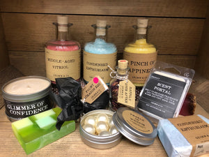 Image showing the collection of potions, otherwise known as bath and body products, with glass-bottled salts, solid shampoo and soaps with plastic-free packaging.