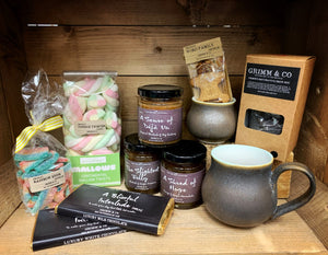 Image showing the collection of foodie treats at Grimm & Co, including sweets, mugs, teas and preserves.