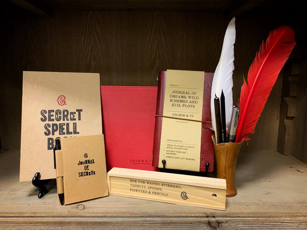 Selection of stationery items from Grimm & Co such as notekeepers, Journal of Dreams, Word Wands and Biro Quills.