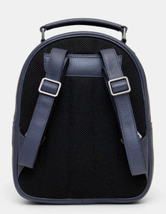 Image shows the back of the navy blue leather Austen backpack with adjustable shoulder straps and top carry handle. Back is padded for added comfort.