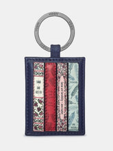 Load image into Gallery viewer, Image shows a navy blue leather keyring with metal ring stamped with YOSHI branding. The keyring design showcases a collection of 4 appliqued book spines featuring classic books by Jane Austen. Titles include Pride &amp; Prejudice, Sense &amp; Sensibility, Emma and Persuasion. 