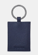 Load image into Gallery viewer, Image shows the back of the navy blue leather Austen keyring with metal ring stamped with YOSHI branding. The bottom of the leather is embossed with YOSHI.