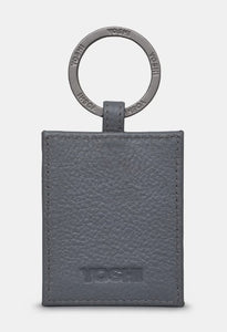 Image shows the back of the Bronte leather keyring with a metal ring stamped with YOSHI branding. The leather is also embossed with YOSHI at the bottom.