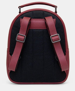 Image shows the cherry red leather backpack with adjustable shoulder straps, carry handle and black padded back for added comfort.