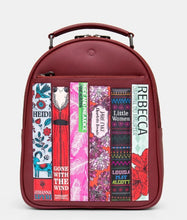 Load image into Gallery viewer, Image shows a cherry red leather backpack with double top zipper and carry handle, front zip pocket and 6 appliqued book spines featuring classic books written by female authors and with female protagonists such as Heidi, Little Women and Gone With The Wind.