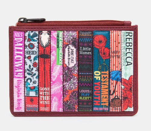 Image shows a cherry red leather zip top purse with appliqued book spines featuring floral patterns in reds and pinks all with female protagonists and  authors.