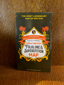 Image shows a folded map named Strumpshaw, Tingleton & Giggleswick's Craftily Conjured Great British Folklore & Superstition Map on a black cover.
