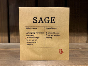 Image shows a packet of Sage seeds. It is a square, flat, kraft brown paper packet., with black text printed in Appareo font. It says Sage at the top, with magical ingredients and side effects printed underneath. 