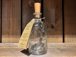  Image showing Bright Ideas Bottle - a glass bottle with LED string lights inside attached to a cork style stopper. In this image the lights are off..