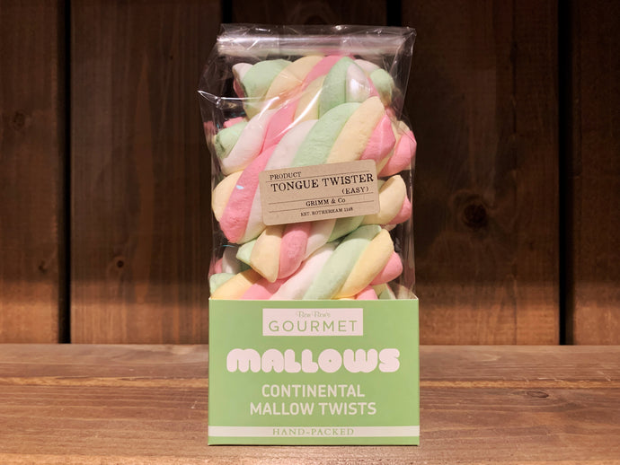 Image showing a cellophane bag of  soft marshmallows in pastel-coloured twist shapes. There is a kraft brown name sticker on the front. 