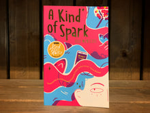Load image into Gallery viewer, Image of the cover for A Kind of Spark. The cover has an illustration of the top quarter of a girls face in the bottom right corner, the rest of the cover is her flowing hair in stripes of red and blue, with sharks and books. 