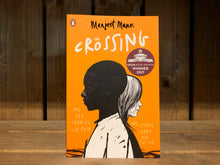Load image into Gallery viewer, Image shows the front cover for The Crossing. It is bright orange, with an illustration of a black boy standing and facing to the left, with a white girl behind him facing to the right. On the right of the illustration in pale yellow &#39;handwritten&#39; text is &#39;the stars carry our future&#39; and on the left &#39; the sea carries our pain&#39;.