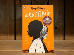 Image shows the front cover for The Crossing. It is bright orange, with an illustration of a black boy standing and facing to the left, with a white girl behind him facing to the right. On the right of the illustration in pale yellow 'handwritten' text is 'the stars carry our future' and on the left ' the sea carries our pain'.