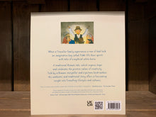 Load image into Gallery viewer, Image of the back cover of Yokki and the Parno Gry. The background is a cream colour with the blurb written in blue text. Above the blurb at the top is a small illustration of a boy telling a story, surrounded by six people. 