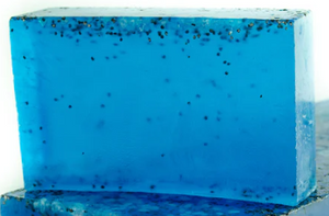 Image of a Condensed Enthusiasm soap bar slice, a sea minerals scented blue soap with poppy seeds inside.