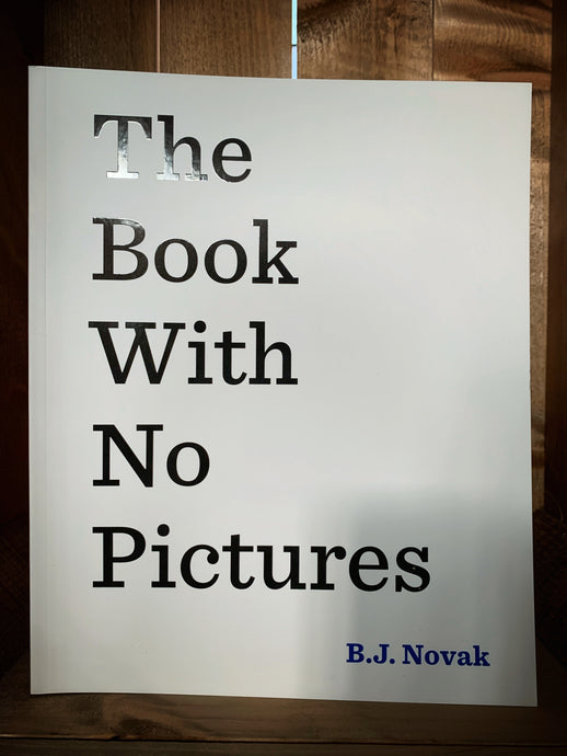 Image of the front cover of The Book With No Pictures. The cover has a plain white background, and the title is written in very large, plain black text on the left side, with only one word on each line. 