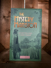 Load image into Gallery viewer, Image of the front of the box for The Mystery Mansion: Storytelling Card Game. The background is a sage green, with the title written in foiled bronze text. There is a basic art deco border, and an illustration of a woman in 1930&#39;s dress in the foreground, and a  mansion hidden behind trees in the distance.