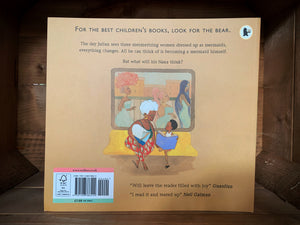 Image of the back of the book Julian is a Mermaid. The cover has a pale orange background, and an illustration of the boy from the front cover sat with his grandmother on a bench, while three women with fancy dresses and hairstyles are walking past a window behind them.