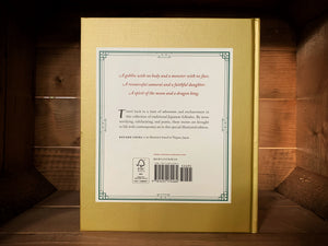 Image of the back of the book Tales of Japan.  The background is matte gold, with a white square in the center where the blurb is written in red and black text.