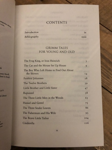 Image inside the hardback book Grimm Tales For Old and Young, showing part of the list of story titles included in the book, such as Hansel & Gretel, Cinderlla, The Brave Little Tailor and The Twelve Brothers.