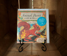 Load image into Gallery viewer, Image shows the front cover of the book/card Animal Poems. The cover shows an illustration of a squirrel on a branch, surrounded by autumn leaves.  it is displayed on a book stand.