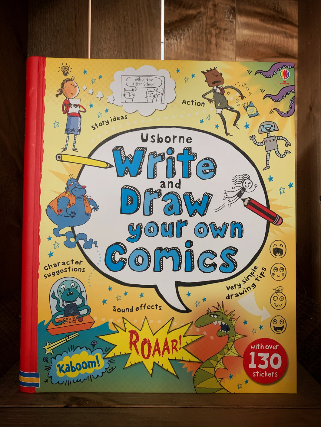 Image of the front of the book Write and Draw Your Own Comics. The cover has a yellow background, with a red spine. The title is written in the center inside a large comic style text bubble, and is surrounded by illustrations of creative creatures and sound effect bubbles, including a dragon, a genie, and an alien. There are small amounts of text around the illustrations explaining what the book can help with, including simple drawing tips, character suggestions, and story ideas.