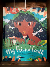 Load image into Gallery viewer, Image of the front cover of the book My Friend Earth.  The cover shows an illustration of a close up of a girls face as she leans on the ground by a river. She is surrounded by plantlife, and a variety of birds, animals, and insects. 