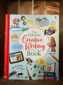 Image of the front cover of The Creative Writing Book. The cover has a pale blue and lined background with a red spine. There are illustrations of various objects and scenes related to forms of creative writing, including a newspaper, and a man filming with a camera under studio lights. There are small amounts of text around the images explaining what the book can help with, including tips for script writing, speech writing, and short stories.