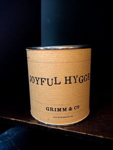 Image shows the kraft wrapped Joyful Hygge tin sealed ready for delivery