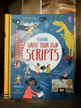 Load image into Gallery viewer, Image of the front cover of Write Your Own Scripts. The background is dark blue, with a yellow spine. The title is written in a white circle in the center, surrounded by illustrations of people filming various scenes, including a superhero flying, and a dinosaur roaring.  There are small amounts of text around the images explaining what the book can help with, including scene setting, and dramatic dialogue. 
