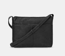 Load image into Gallery viewer, Image shows the back of the black Yoshi leather Charles Dickens bookworm cross-body bag with a back slip pocket embossed with YOSHI and the genuine leather symbol.