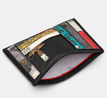 Load image into Gallery viewer, Image shows the black Yoshi leather Charles Dickens slim card holder held open to reveal the white lining printed with grey YOSHI text. Design features appliqued book spines on the front.
