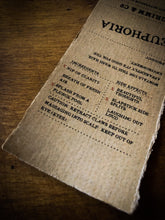 Load image into Gallery viewer, Close up of Euphoria kraft paper label showing faux ingredients and side effects
